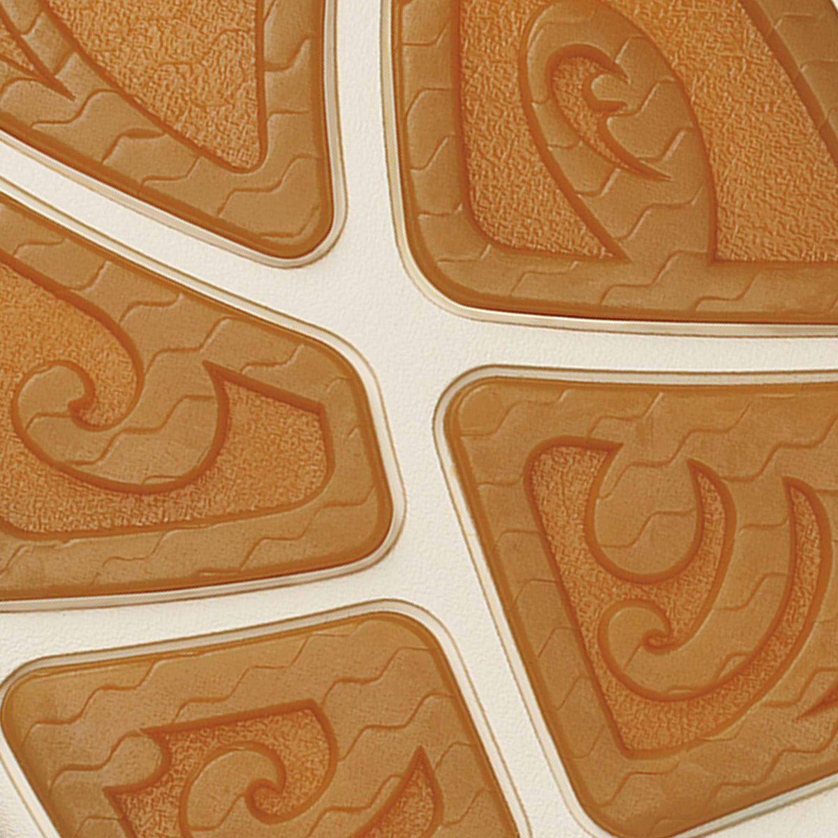 Tan sole with white midsole stripe and embossed decorative pattern detail.