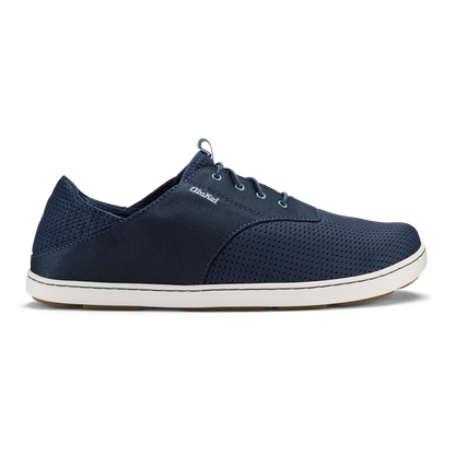 Navy blue lace-up casual shoe with perforated mesh panels and white sole.