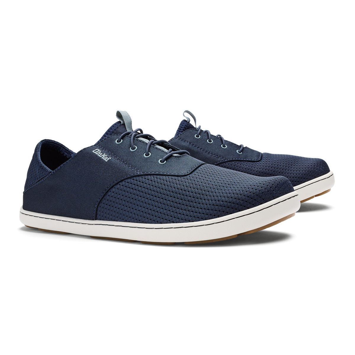 Navy blue lace-up casual shoe with white sole and textured upper material.