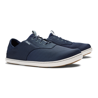 Navy blue lace-up casual shoe with white sole and textured upper material.