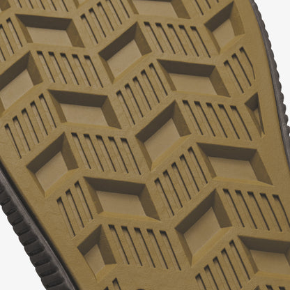 Tan and dark rubber sole with geometric treads and diamond-shaped grip pattern.