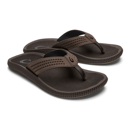 Pair of dark brown flip-flops with perforated straps and textured soles.