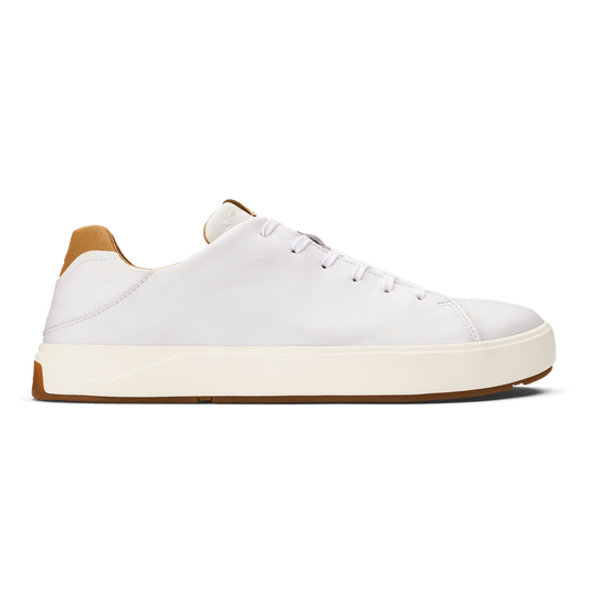 White leather low-top sneaker with cream sole and tan heel patch, laced closure.