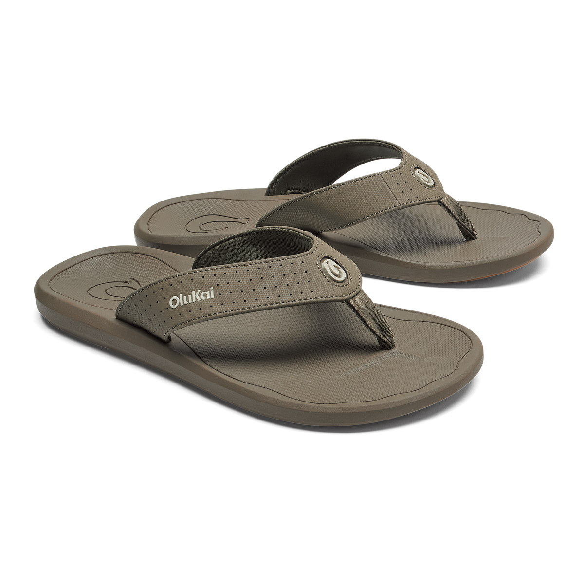 Pair of walnut-colored OluKai Ki'i flip-flop sandals with textured straps and contoured footbeds.