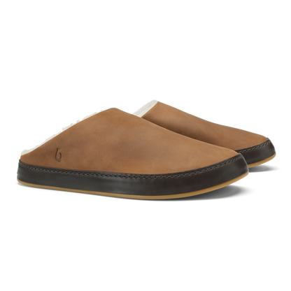 Pair of toffee-colored suede slippers with dark java leather trim and tan rubber soles.