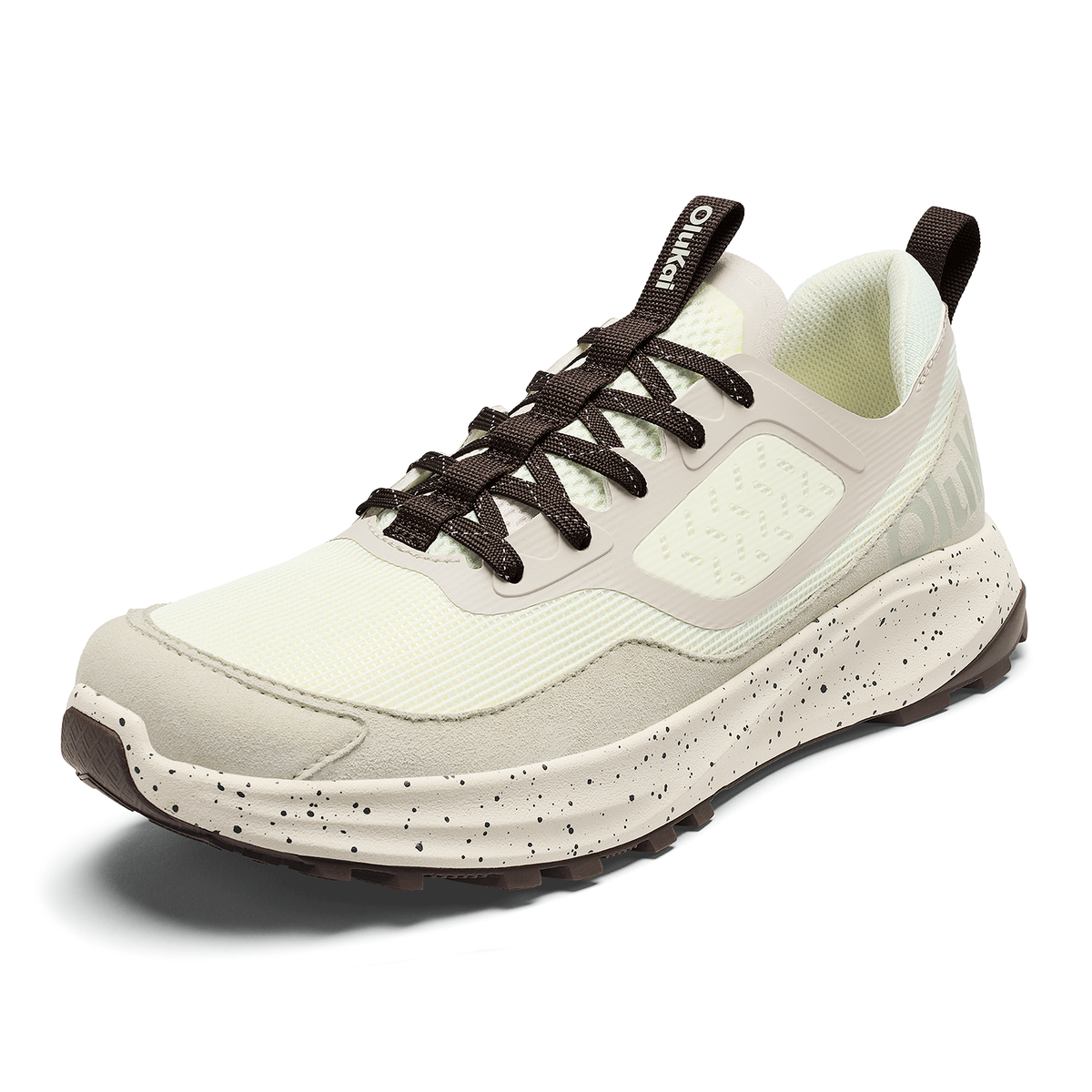 White athletic shoe with black laces, speckled white and black midsole, and light green mesh interior lining.
