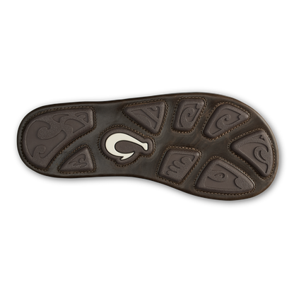 Brown leather sandal sole with embossed design pattern and cream-colored curved logo accent in center.