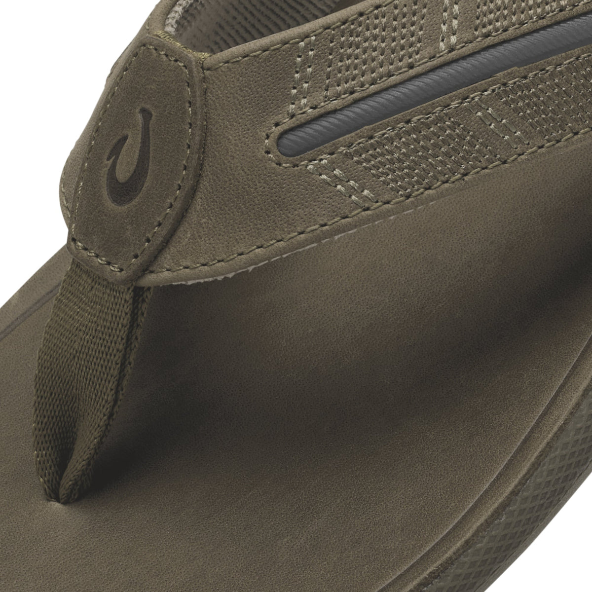 Tan leather slip-on shoe with textured mesh panel, stitched detailing, and branded heel tab.
