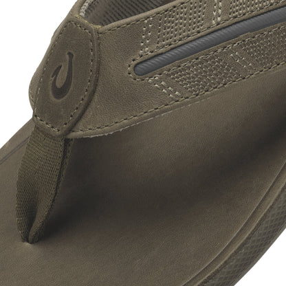 Tan leather slip-on shoe with textured mesh panel, stitched detailing, and branded heel tab.