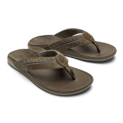 Pair of tan thong sandals with textured straps and cushioned soles.