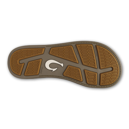 Tan and gray shoe sole with honeycomb tread pattern and white curved logo detail.