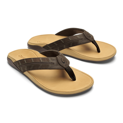 Pair of dark brown and tan thong sandals with padded footbeds and toe post straps.