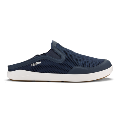 Trench blue slip-on mule shoe with white sole and mesh upper panel featuring OluKai branding.