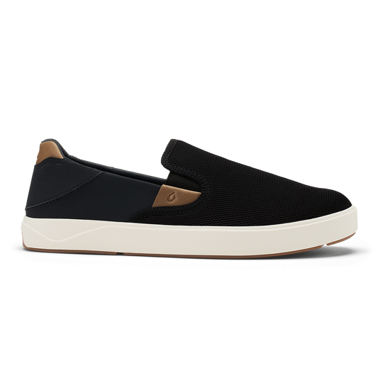 Black slip-on sneaker with tan heel panel and cream rubber sole.