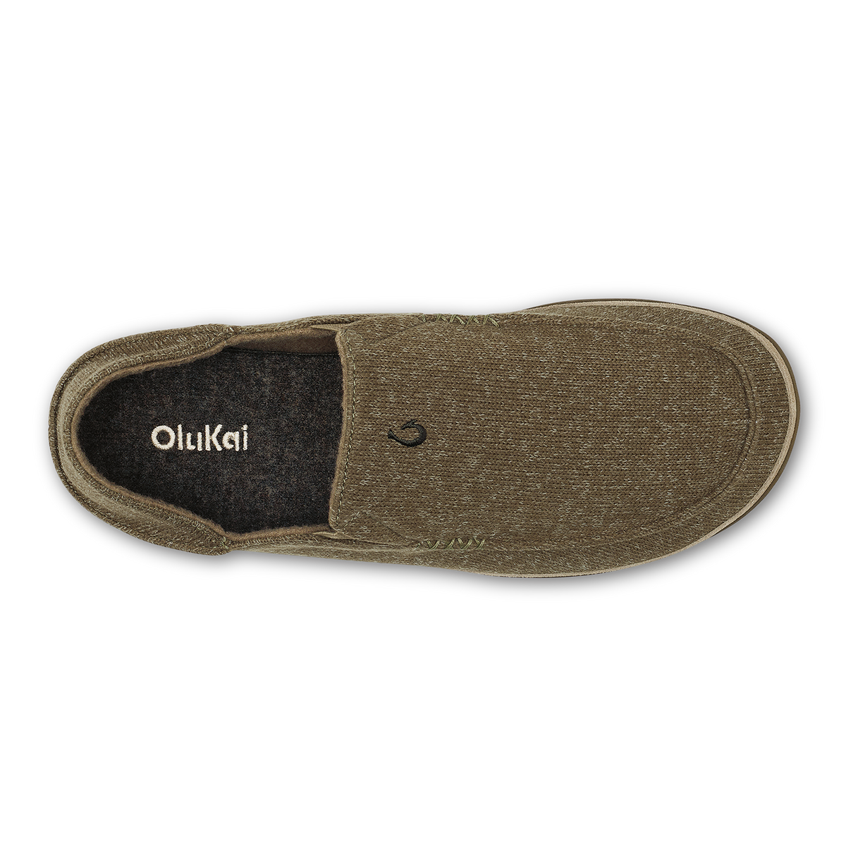 Clay-colored slip-on slipper with black fleece lining and OluKai branding visible on the insole.