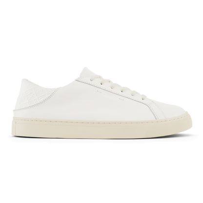 White leather lace-up sneaker with cream rubber sole and textured heel panel.
