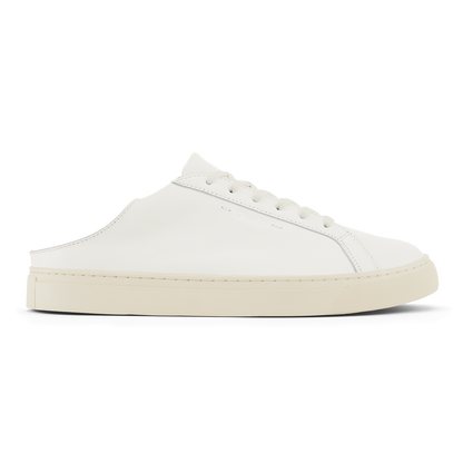 White leather lace-up mule sneaker with cream rubber sole and stitched detailing.