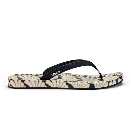 Blue and cream flip-flop with geometric patterned footbed and black toe strap.
