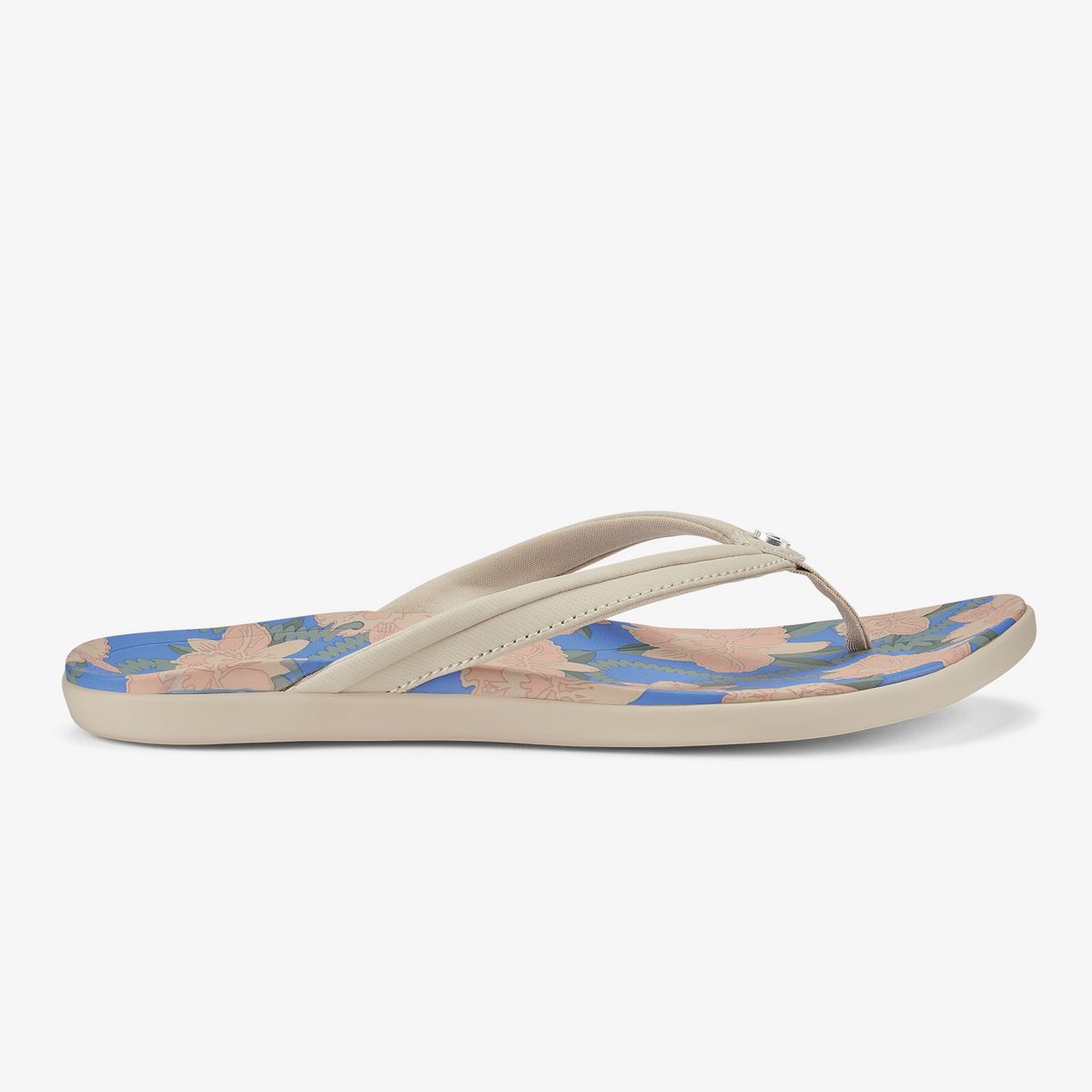 Cream and blue flip-flop with tapa floral pattern on footbed and marine blue sole.