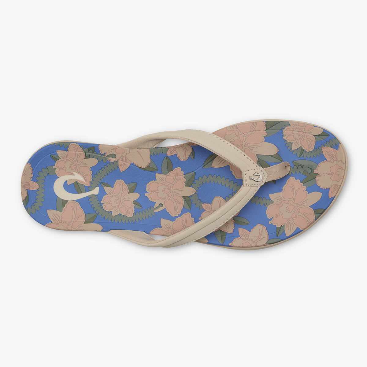 Flip-flop sandal with marine blue footbed featuring pink and green floral tapa pattern and tan crossover straps.