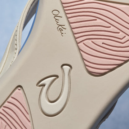Cream and mauve/pink tapa-patterned sandal with embossed logo detail and textured upper sole.
