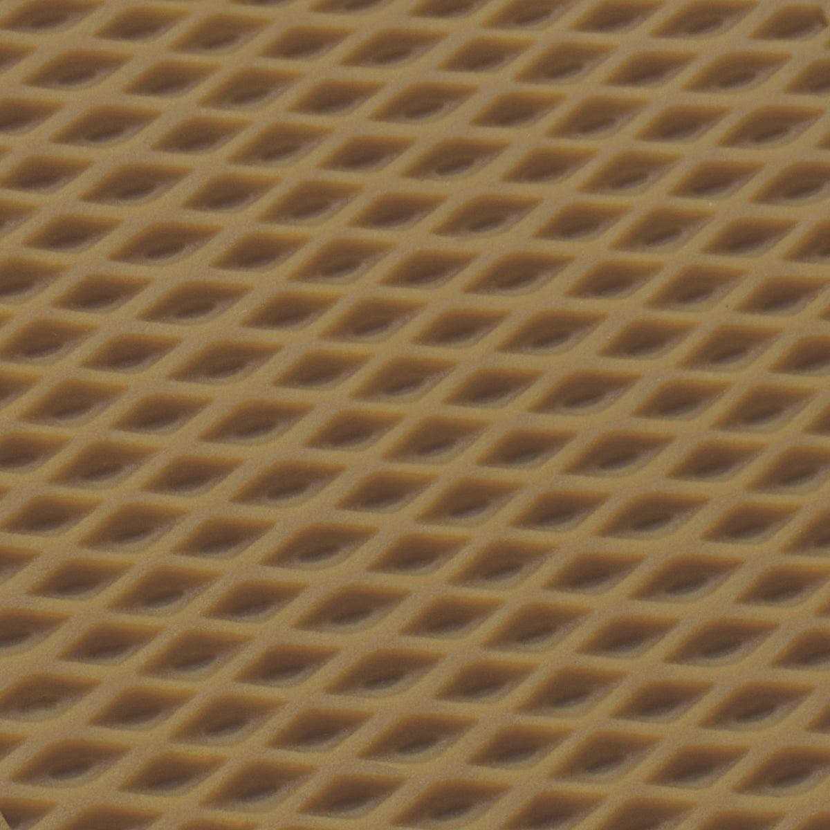 Textured tan surface with repeating diamond-shaped cutout pattern.