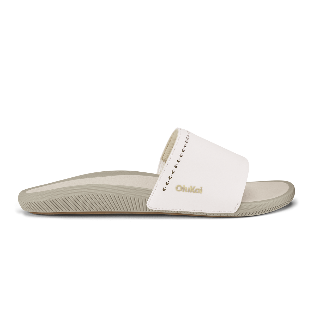 White and tan slide sandal with ribbed sole and decorative stitching on upper strap.