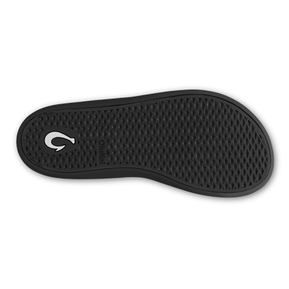 Black shoe sole with textured tread pattern and white curved logo on heel.