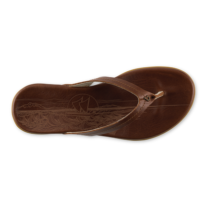 Toffee-colored flip-flop with embossed canoe and wave design on footbed and thong strap.