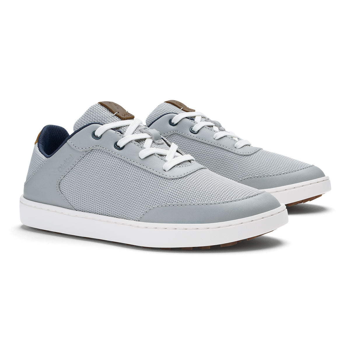 Grey and tan lace-up sneaker with white sole and navy heel tab.