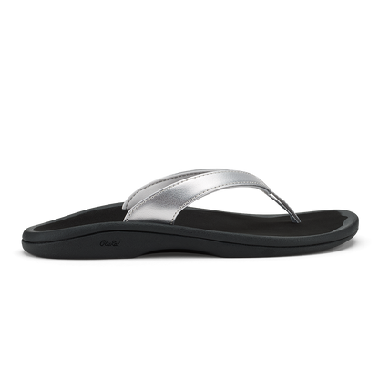 Silver and black thong sandal with curved footbed and metallic upper strap.