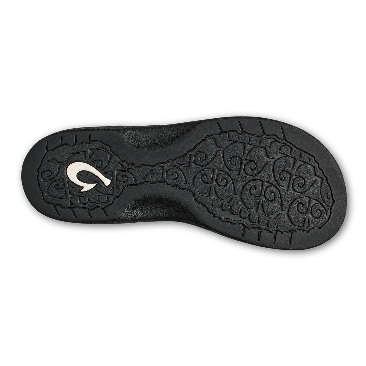 Black shoe sole with ornamental scroll pattern and silver curved logo detail.